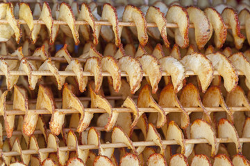 fried potatoes on wooden sticks, spiral