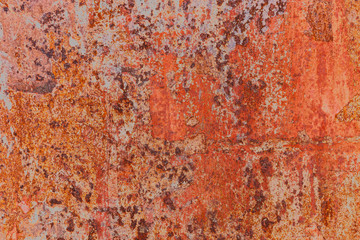 Red painted metal with rust