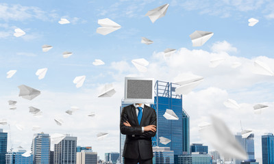 Businessman with monitor instead of head.
