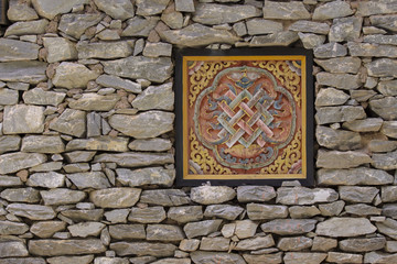 Tradition tibetan windows and stone wall.