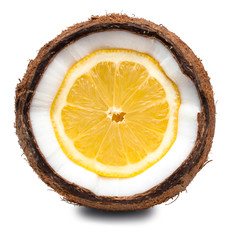 Lemon inside coconut isolated on white