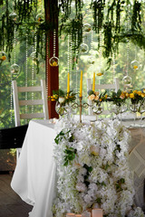 Wedding table decoration. Wedding flowers in yellow