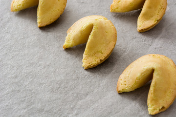 Fortune cookies on gray stone background