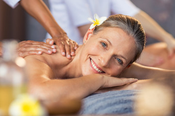 Woman getting oil massage at spa