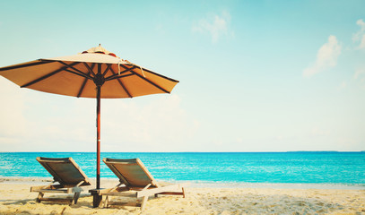 Two beach chairs on tropical vacation