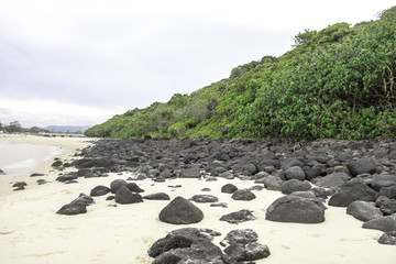 Black Rocks and Sand Beach at Burleigh Beach, Gold Coast Australia