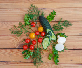 Fresh vegetables on wooden background.