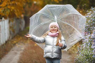 Cute little child in the fall time. Adorable girl in the autumn