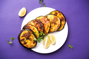 Pan fry crispy baigan / eggplant / brinjal recipe from India. selective focus
