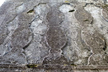 Beautiful relief and texture of stone with patterns and moss. Stone natural background.