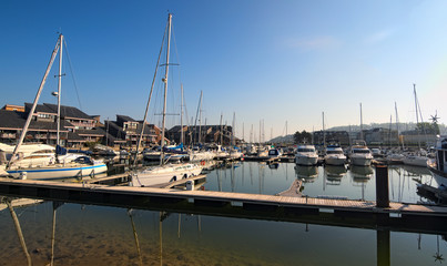 DEAUVILLE, FRANCE-MAY 05,2018: Yacht in the port of Deauville, Calvados departement in the Normandy region in France. Early morning view