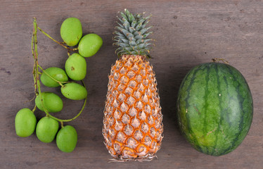 Tropical fruit on wooden table,  Mango and Pineapple and Watermelon
