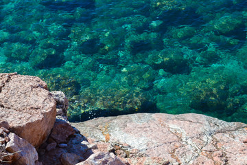 Nice view of the sea. Calm clean sea. Large stones. View from above. The Adriatic. Montenegro