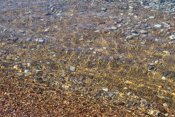 Beautiful sea view. A calm sea by the shore. Clean pebble beach. The Adriatic. Montenegro