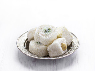 Traditional Turkish sweets lukum on a silver saucer