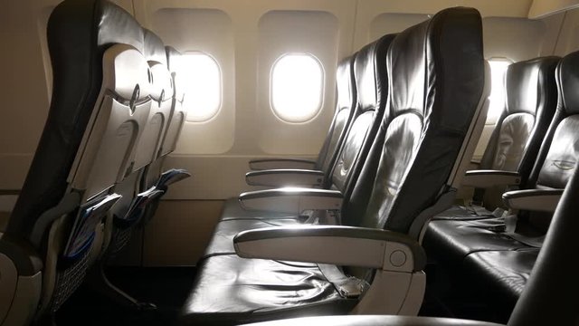 View of inside airplane with empty plane seat