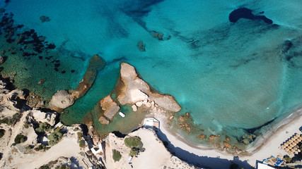 Fototapeta na wymiar Aerial drone bird's eye view of iconic volcanic white chalk iconic beach of Firiplaka, Milos island, Cyclades, Greece