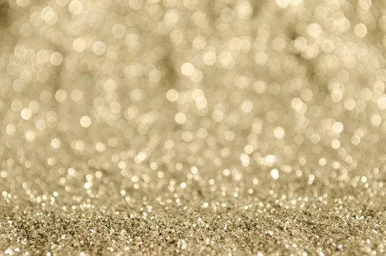 Champagne colored bokeh background.