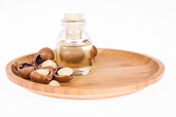Obraz na płótnie Canvas Macadamia nuts oil or Australian walnuts on white background
