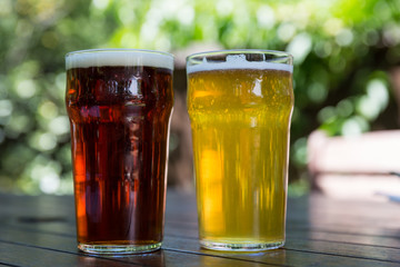 A pint of English bitter and yellow lager at a pub in Arrowtown, New Zealand