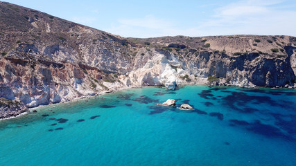 Fototapeta na wymiar Aerial drone bird's eye view photo of rocky seascape near picturesque fishing village of Firopotamos with turquoise clear waters, Milos island, Cyclades, Greece