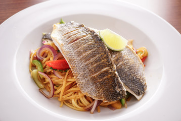 Trio of Fish Cooked on a Bed Of Noodles