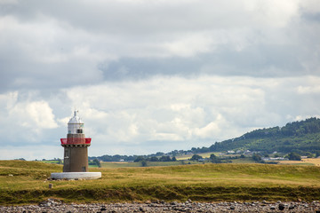 Fototapeta na wymiar Oyster Lighthouse located on the Oyster Island near Rosses Point Village in County Sligo Ireland 
