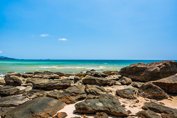Fototapeta na wymiar Sea rocks on the beach in sunny day