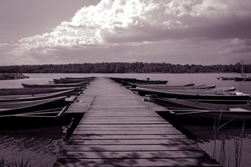 jetty with small rowing boats