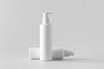 Fototapeta na wymiar White cosmetic shampoo dispenser bottle mock-up.