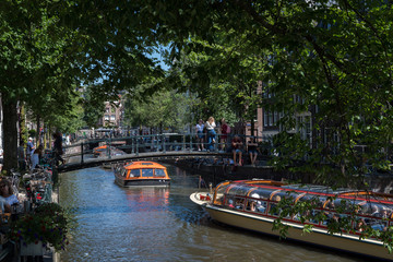 Fototapeta na wymiar Boats on the Brouwersgracht, Amsterdam, Netherlands