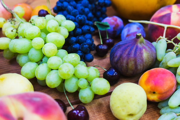 Fresh fruits on the wooden counter of a small vegetable market. 
