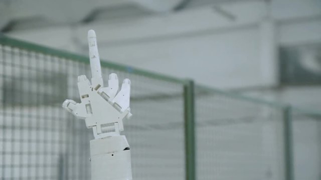 The robotic hand show fuck, middle finger on the camera. 4K