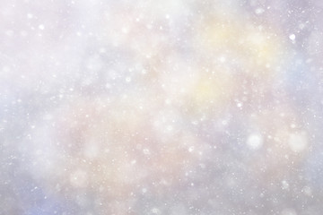 Snowfall texture of snowflakes on blurred background