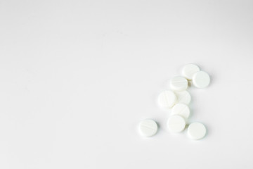 White tablets. The concept of medicine, disease, health.