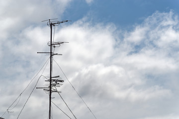 Television aerial against cloudy sky. Komsomolsk-on-Amur, Russia