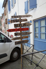 Signs pointing the direction and distance of some main European cities