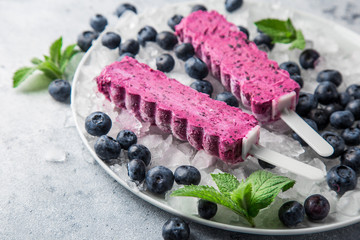 homemade blueberry popsicles with fresh berries