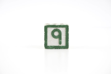 Colored wooden letter blocks on a white background with copy space