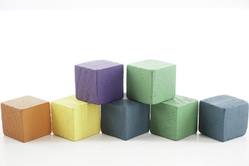 Wooden cube blocks over white background