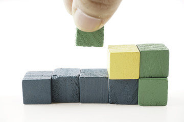 Wooden cube blocks over white background