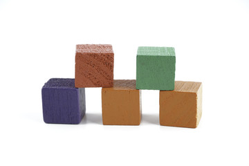 Wooden cube blocks over white background