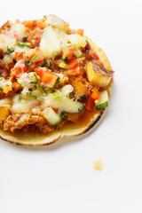 Close up of mexican taco with chili con carne, grilled sweet potatoes and grated cheese on white background. Text space