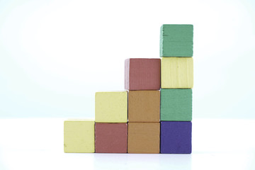 Wooden cube blocks over white background
