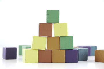 Wooden cube blocks over white background