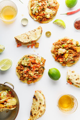Mexican tacos with chili con carne, grilled sweet potatoes and grated cheese on white background. Text space