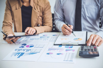 Business people discussion, Executive team discussing the charts and graphs working in business strategy and financial plan to investment profit