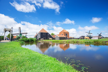 Fototapeta na wymiar windmill and view of famous place Zaanse Schans farm and industr