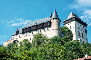Fototapeta na wymiar Large gothic castle Karlstejn, blue filter