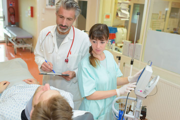 doctor and nurse telling patient the diagnosis
